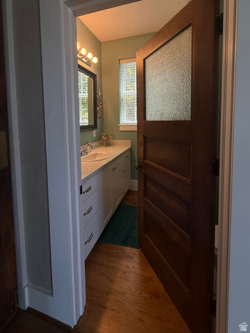 776 Canyon Road Hyde Park, UT 84318 - Photo 15 of 57 Bathroom with a single vanity featuring an undermount sink and a light-toned countertop