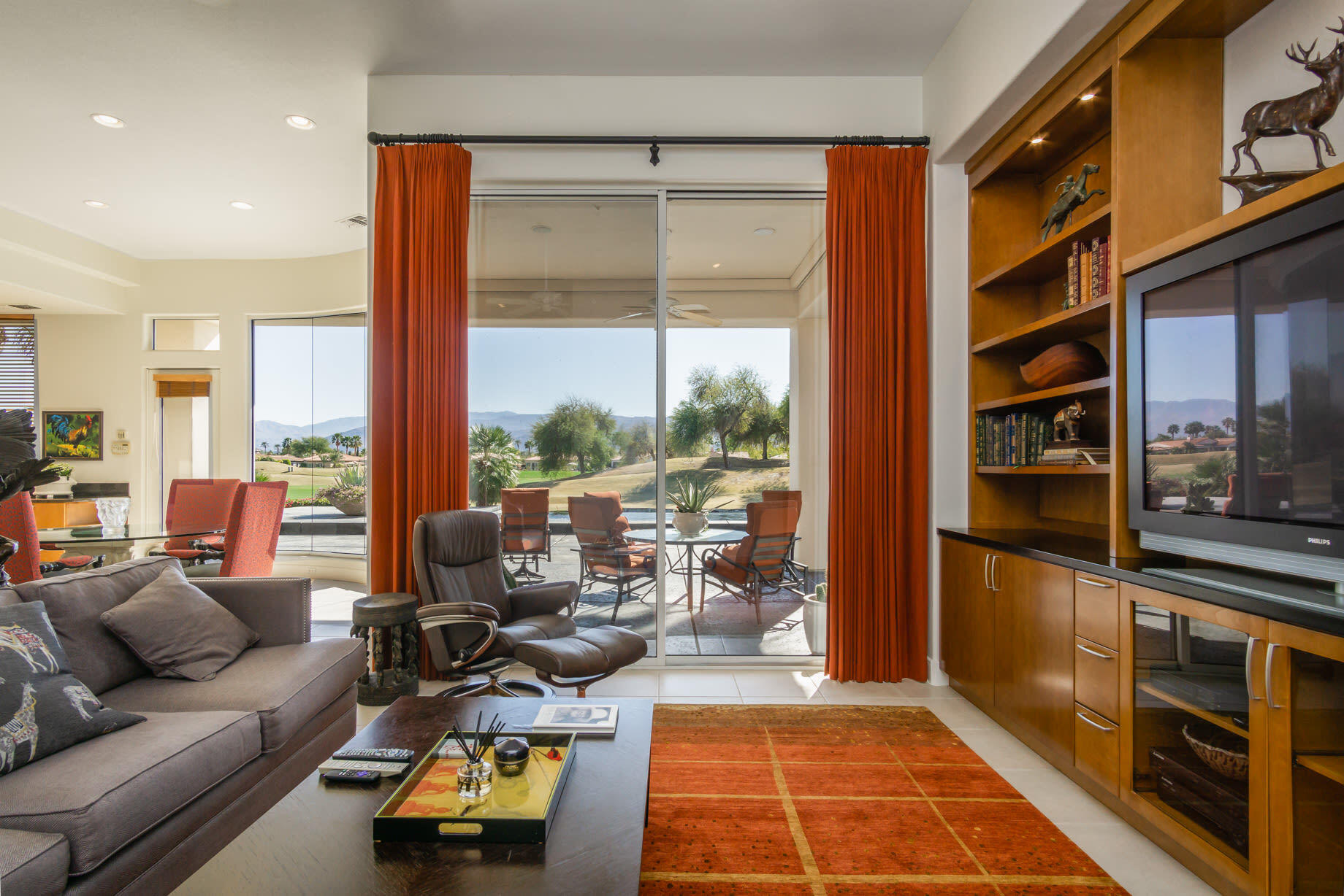 238 Loch Lomond Road Rancho Mirage, CA 92270 - Photo 12 of 44 a living room with furniture a large window and stainless steel appliances