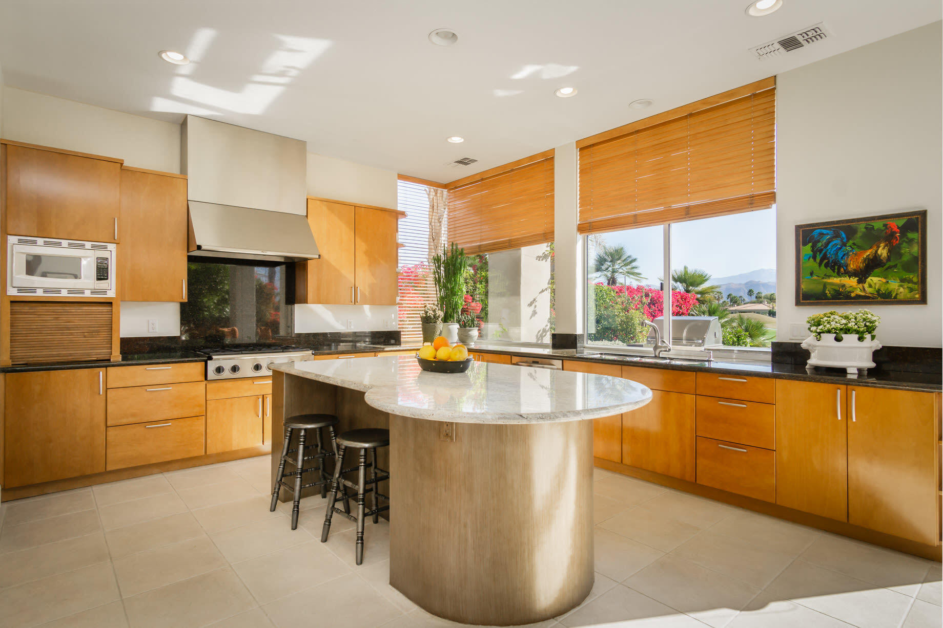 238 Loch Lomond Road Rancho Mirage, CA 92270 - Photo 17 of 44 a kitchen with stainless steel appliances granite countertop a sink a stove and a refrigerator