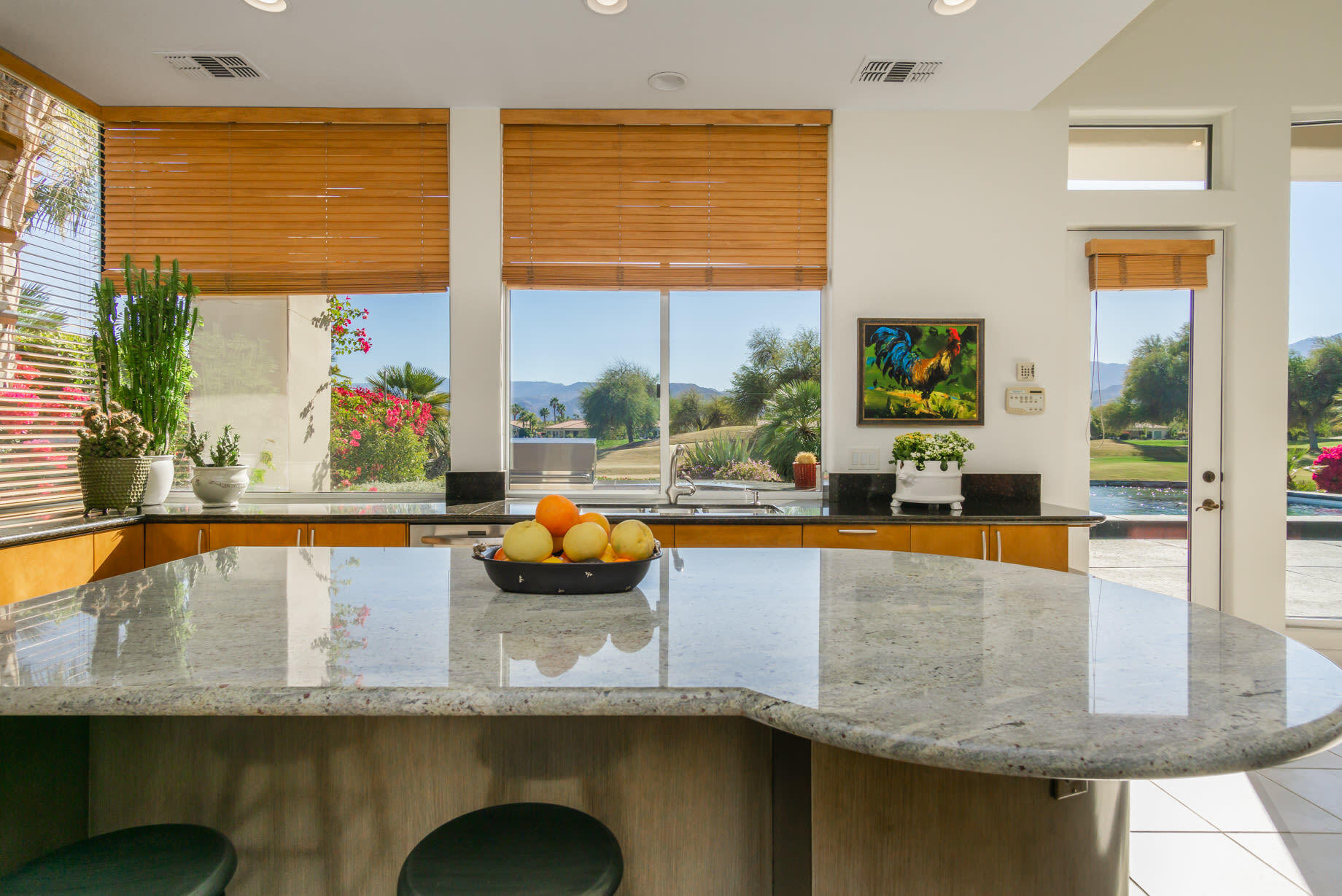 238 Loch Lomond Road Rancho Mirage, CA 92270 - Photo 19 of 44 a view of a living room with furniture and floor to ceiling window