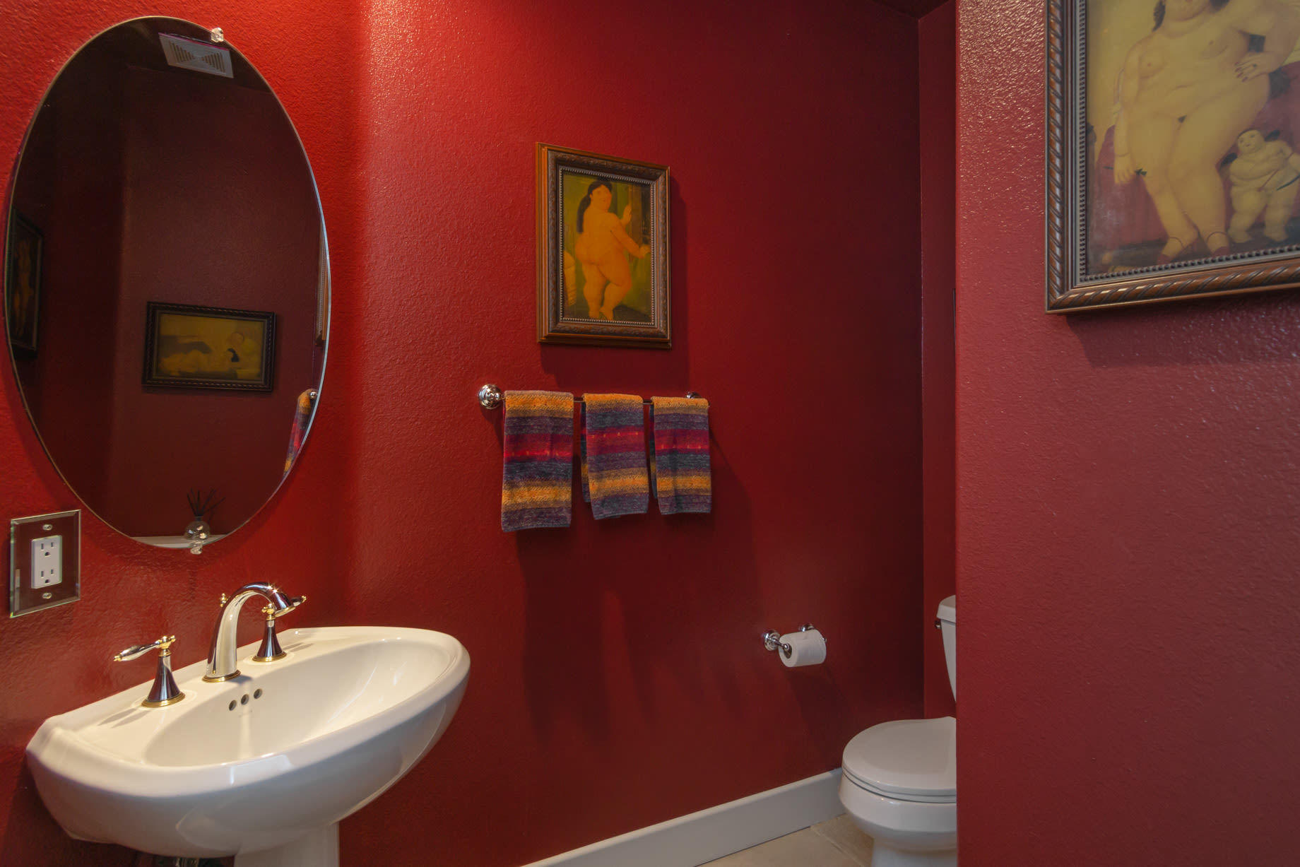 238 Loch Lomond Road Rancho Mirage, CA 92270 - Photo 22 of 44 a bathroom with a toilet a sink and mirror