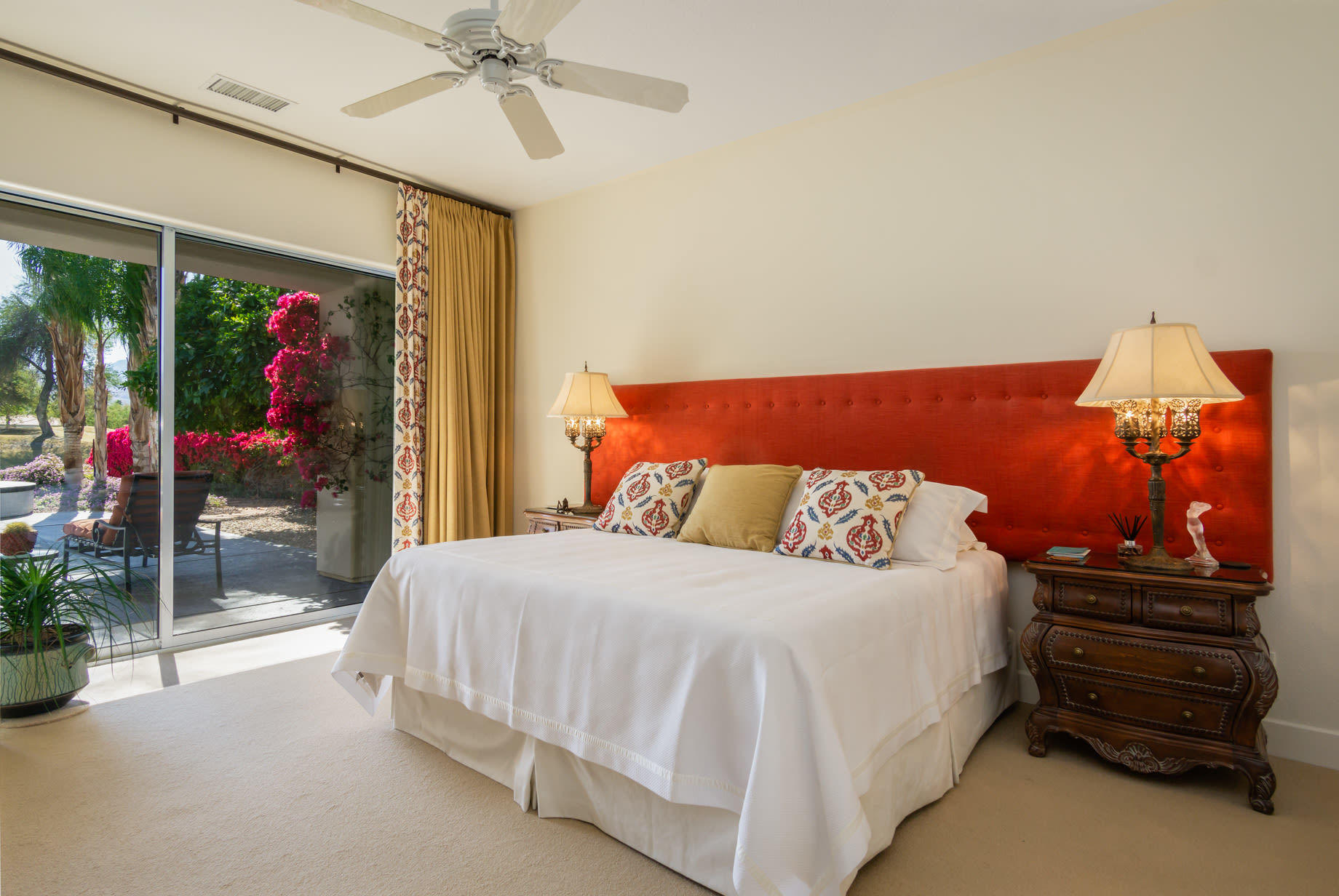 238 Loch Lomond Road Rancho Mirage, CA 92270 - Photo 23 of 44 a bedroom with a bed and a chandelier