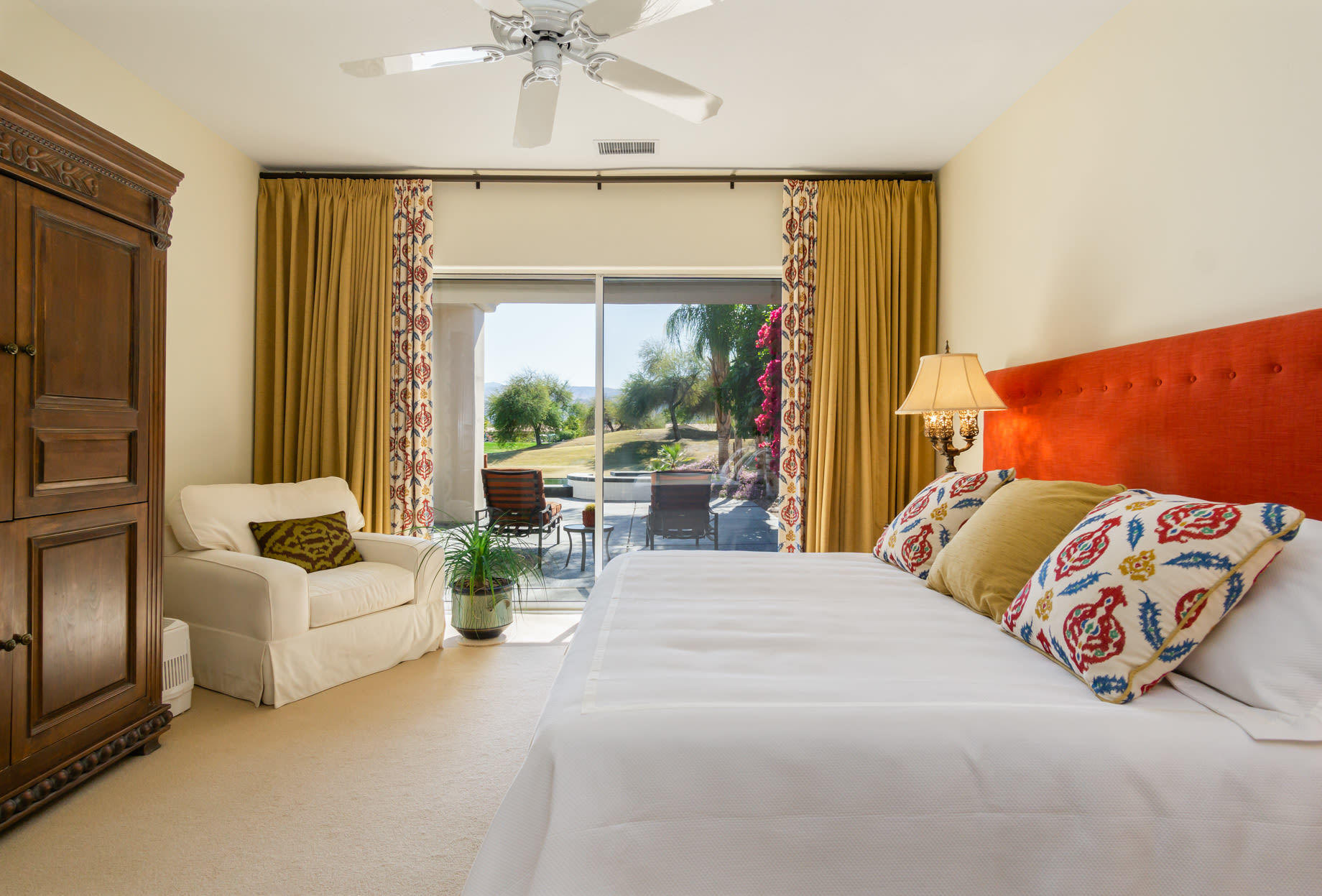 238 Loch Lomond Road Rancho Mirage, CA 92270 - Photo 24 of 44 a bedroom with a bed couch and window