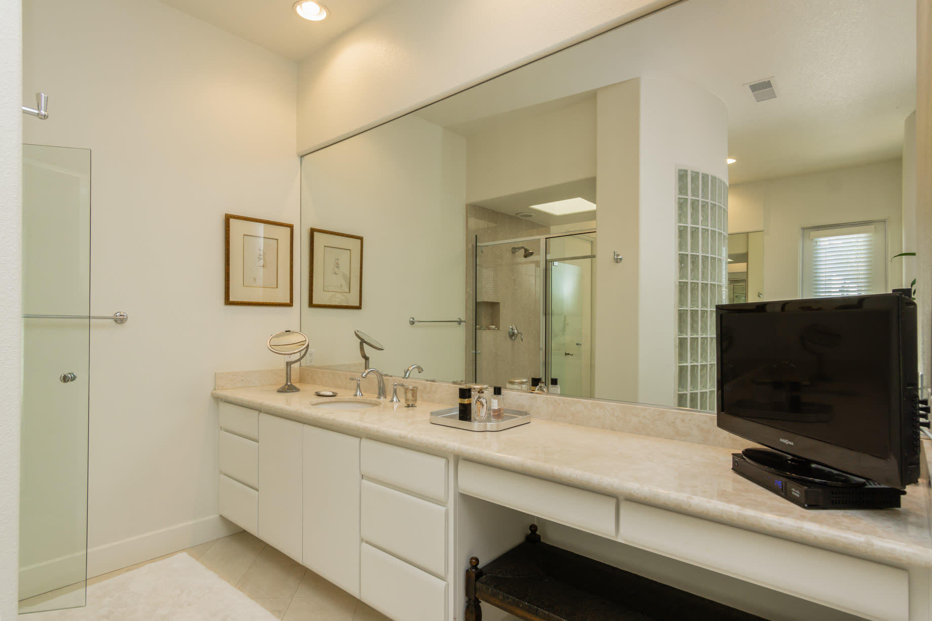 238 Loch Lomond Road Rancho Mirage, CA 92270 - Photo 29 of 44 a bathroom with a double vanity sink and mirror