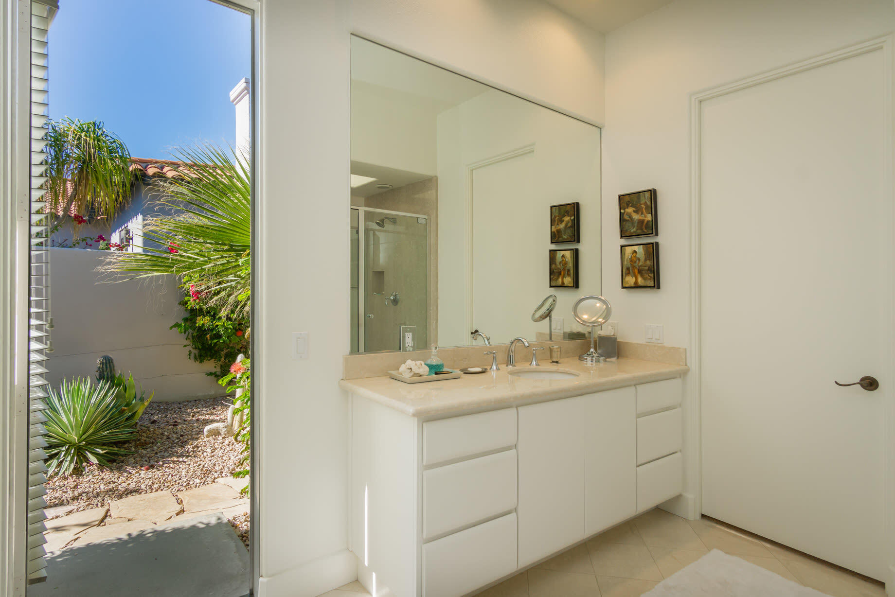 238 Loch Lomond Road Rancho Mirage, CA 92270 - Photo 30 of 44 a bathroom with a sink and a mirror