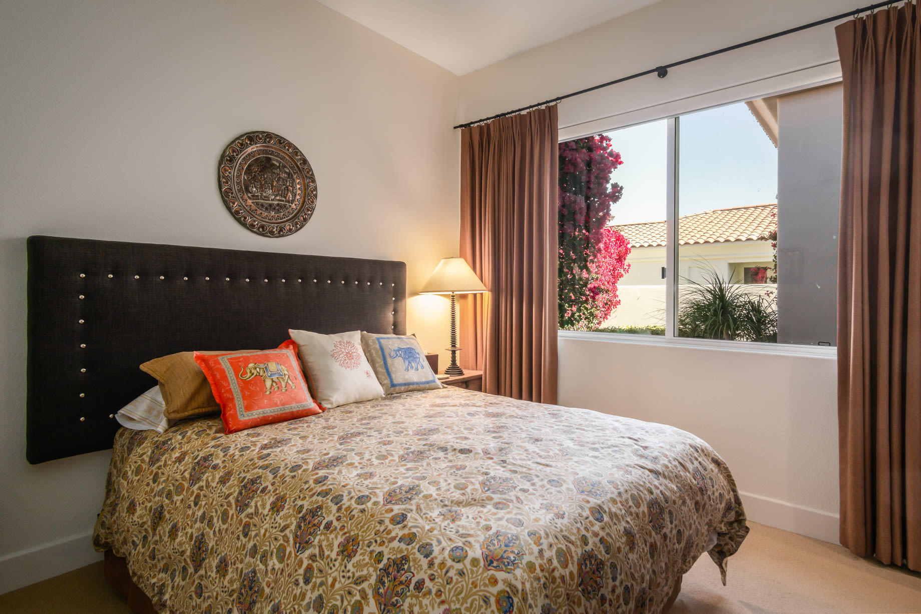 238 Loch Lomond Road Rancho Mirage, CA 92270 - Photo 33 of 44 a bed sitting in a bedroom next to a window