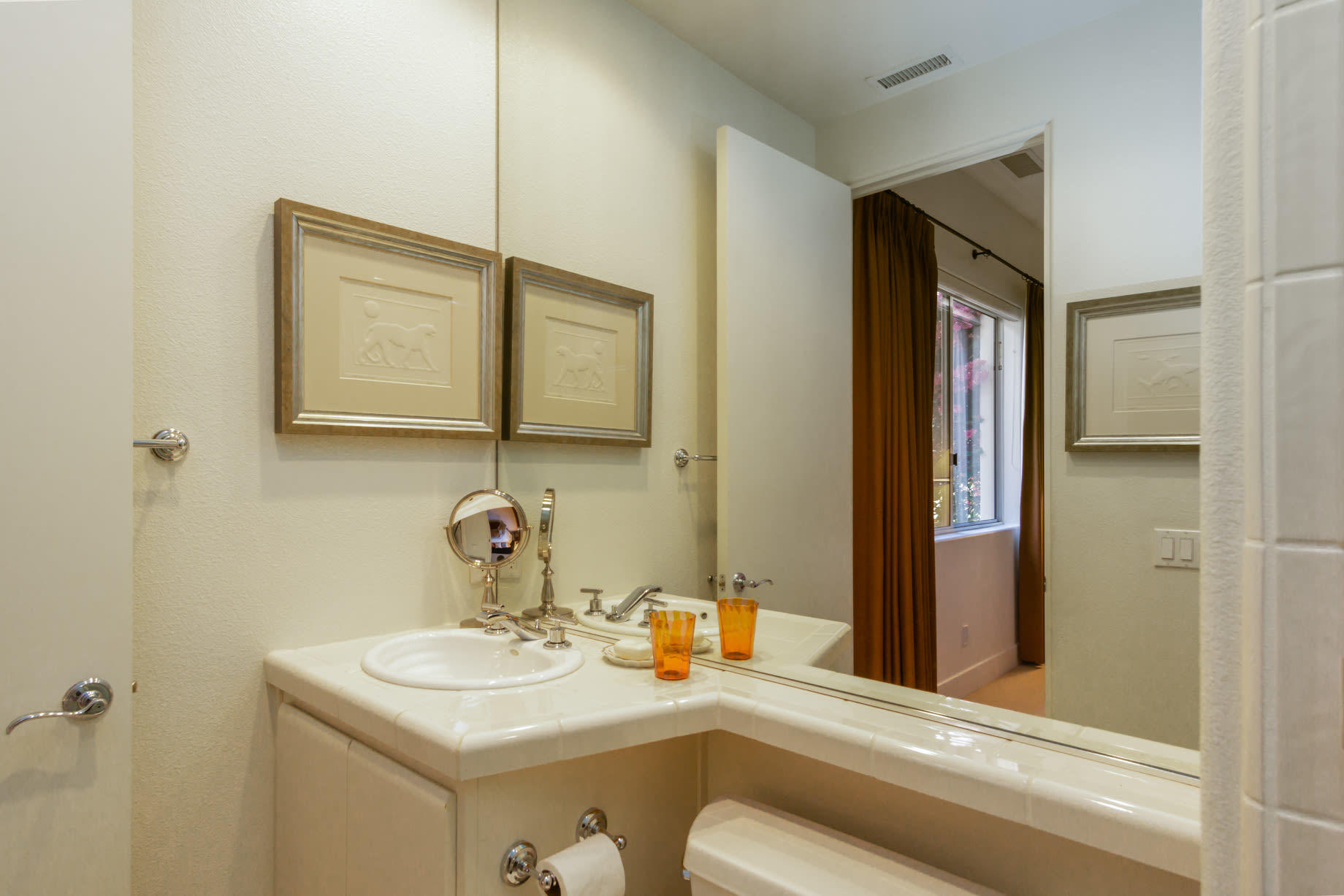 238 Loch Lomond Road Rancho Mirage, CA 92270 - Photo 34 of 44 a bathroom with a sink and a mirror