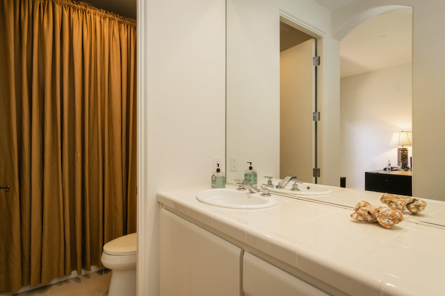 238 Loch Lomond Road Rancho Mirage, CA 92270 - Photo 36 of 44 a bathroom with a sink and a mirror