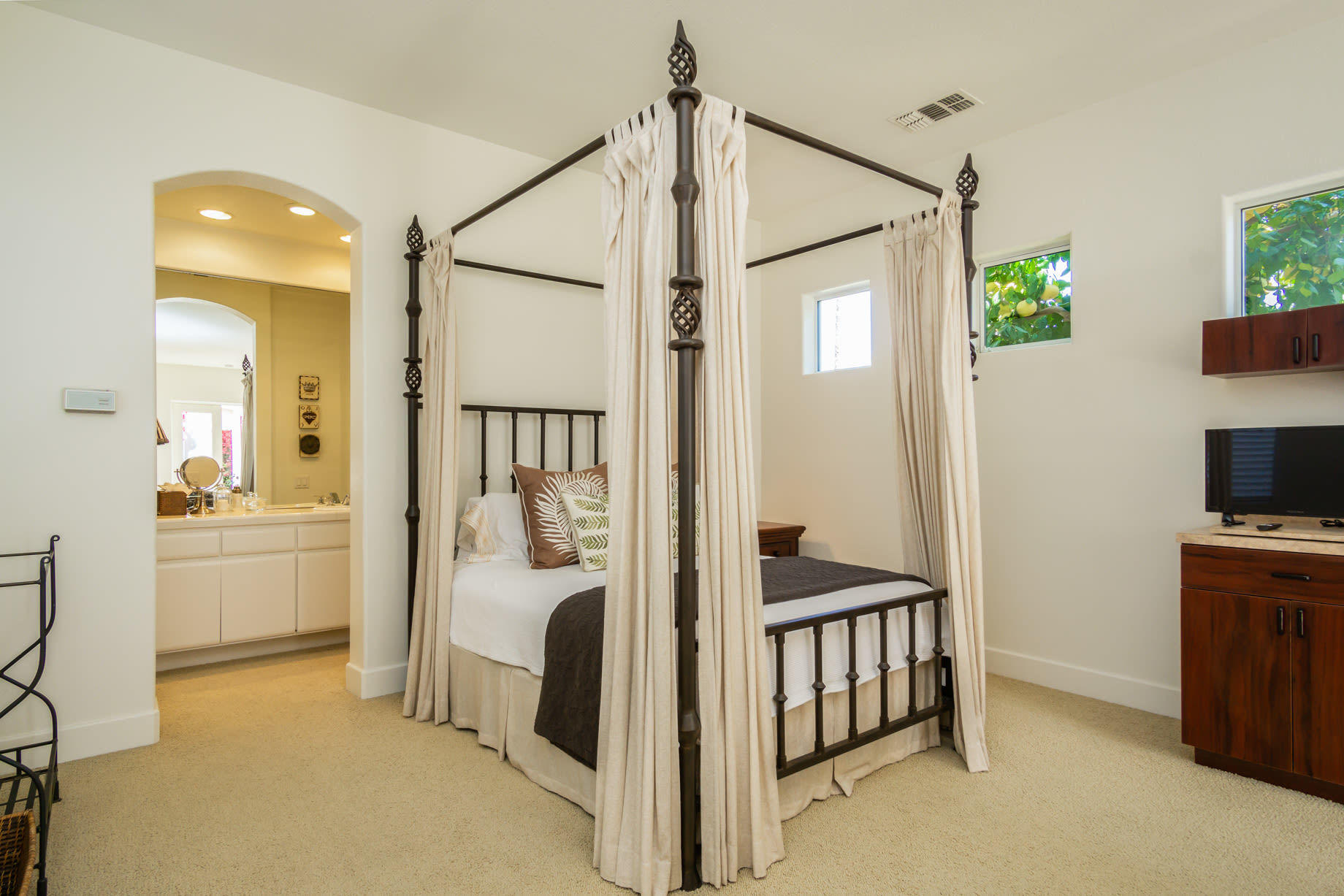238 Loch Lomond Road Rancho Mirage, CA 92270 - Photo 37 of 44 a bedroom with a bed and a television