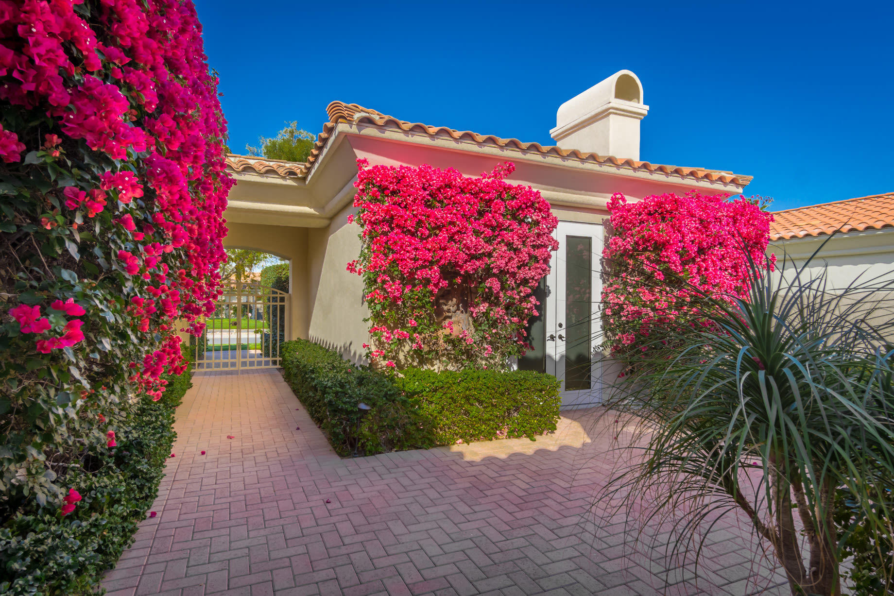 238 Loch Lomond Road Rancho Mirage, CA 92270 - Photo 5 of 44 a front view of a house with yard