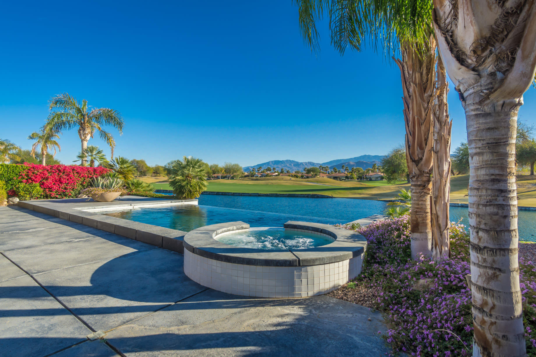 238 Loch Lomond Road Rancho Mirage, CA 92270 - Photo 43 of 44 a view of a swimming pool with a yard
