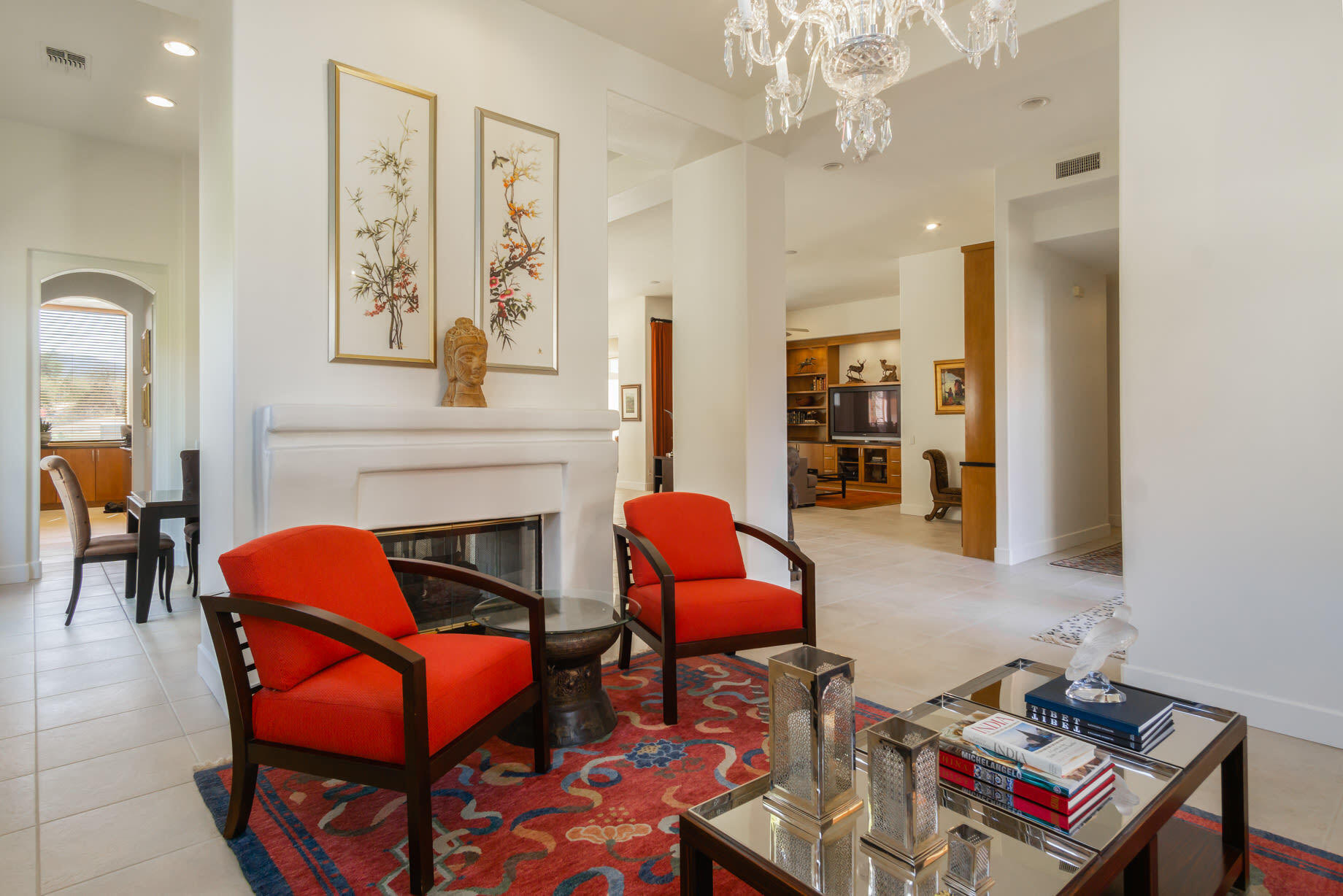 238 Loch Lomond Road Rancho Mirage, CA 92270 - Photo 8 of 44 a living room with furniture a fireplace and a chandelier