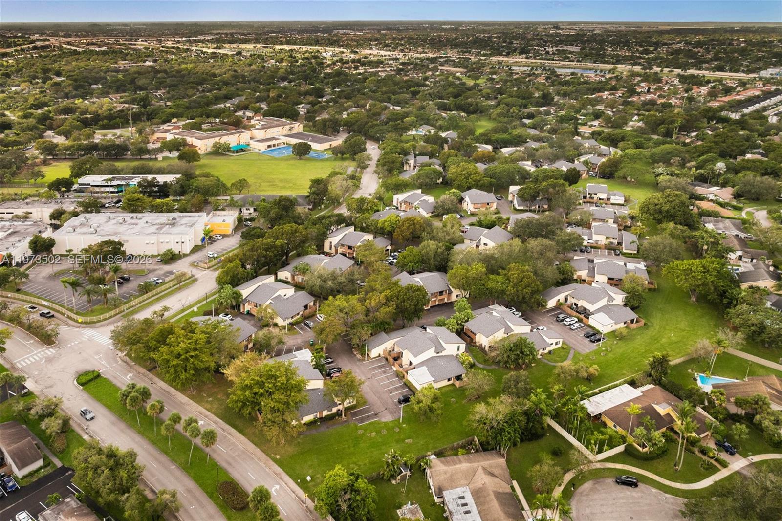 11353 Southwest 109th Road, Unit 55X Miami, FL 33176 - Photo 26 of 26 an aerial view of residential houses with outdoor space