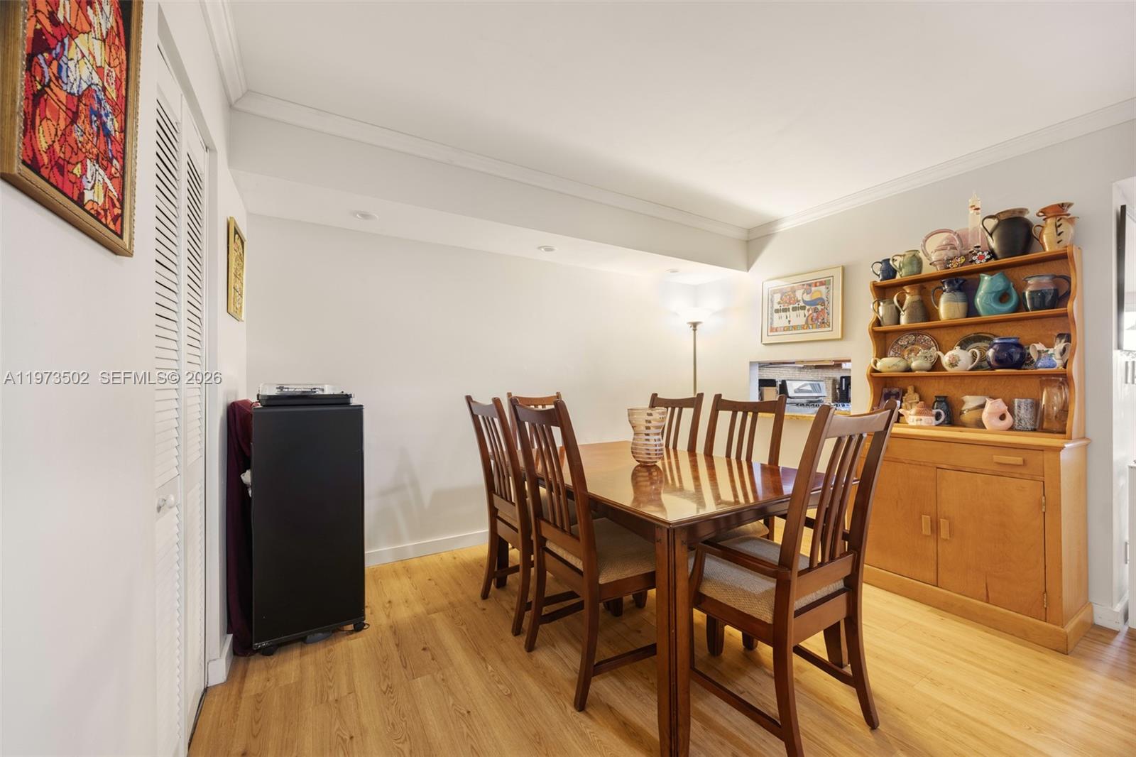 11353 Southwest 109th Road, Unit 55X Miami, FL 33176 - Photo 10 of 26 a dining room with furniture and wooden floor