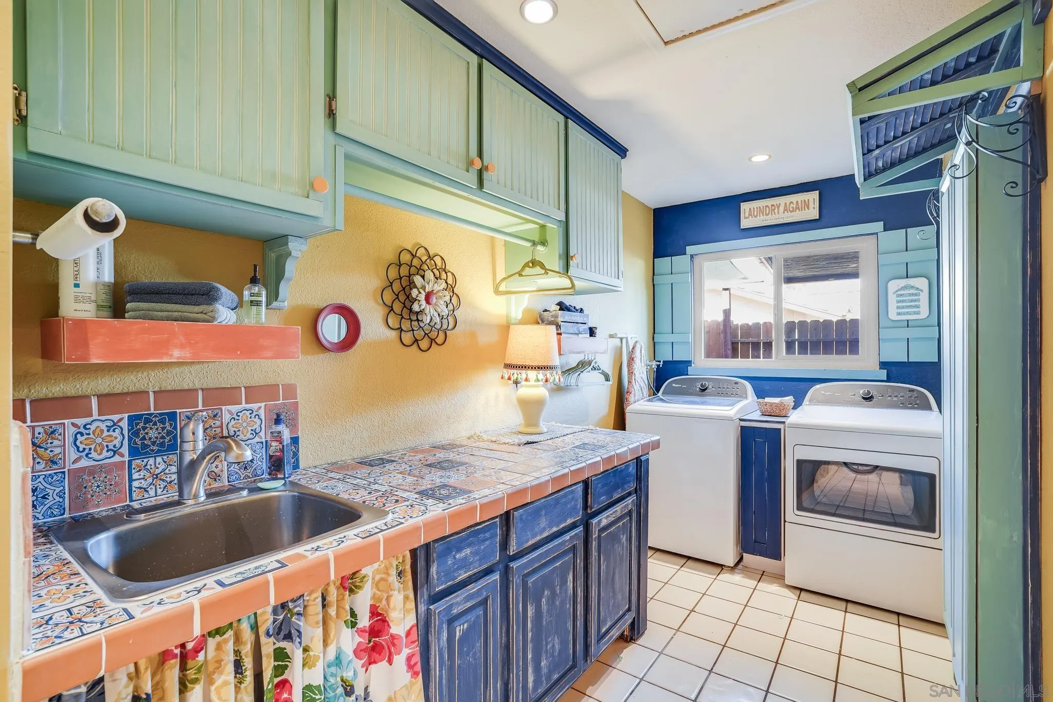 3764 Avocado Boulevard La Mesa, CA 91941 - Photo 31 of 66 a kitchen with stainless steel appliances granite countertop a sink and a wooden cabinets