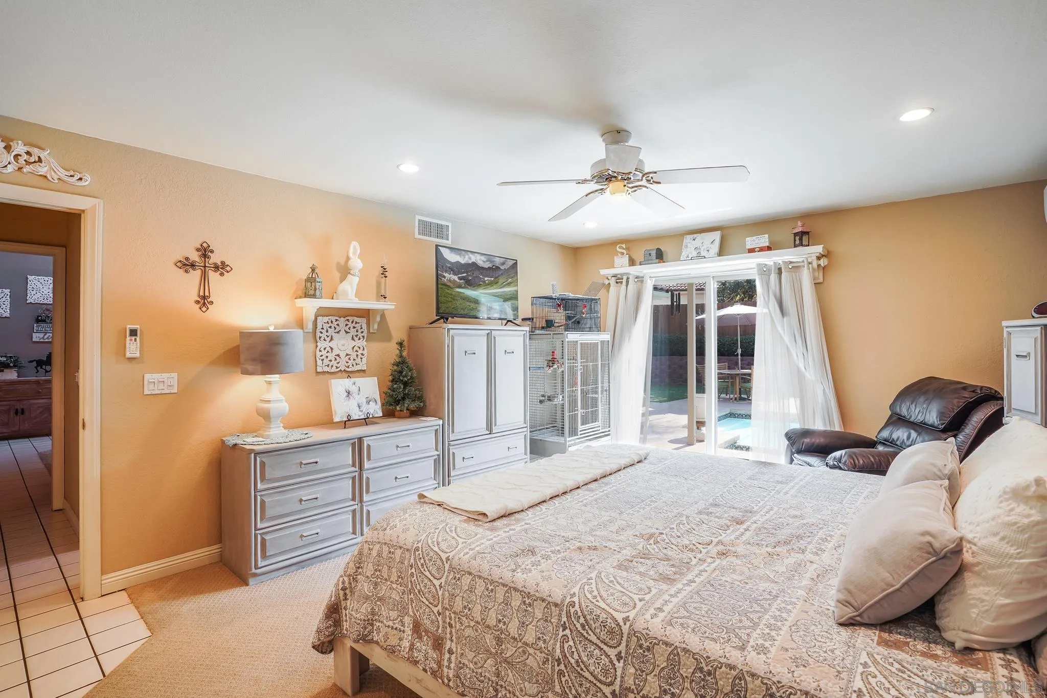 3764 Avocado Boulevard La Mesa, CA 91941 - Photo 37 of 66 a bedroom with a bed cabinets and a window