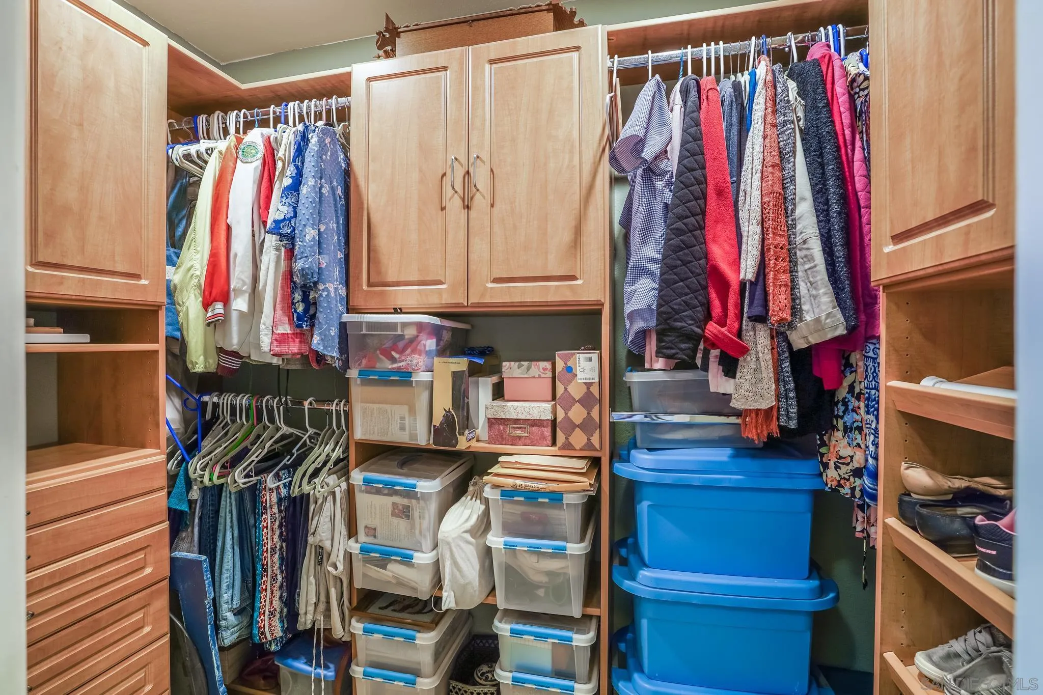 3764 Avocado Boulevard La Mesa, CA 91941 - Photo 46 of 66 a view of walk in closet with clothes and shoes