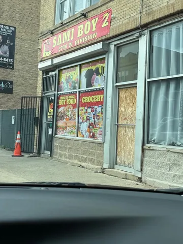a view of a brick house with a large windows