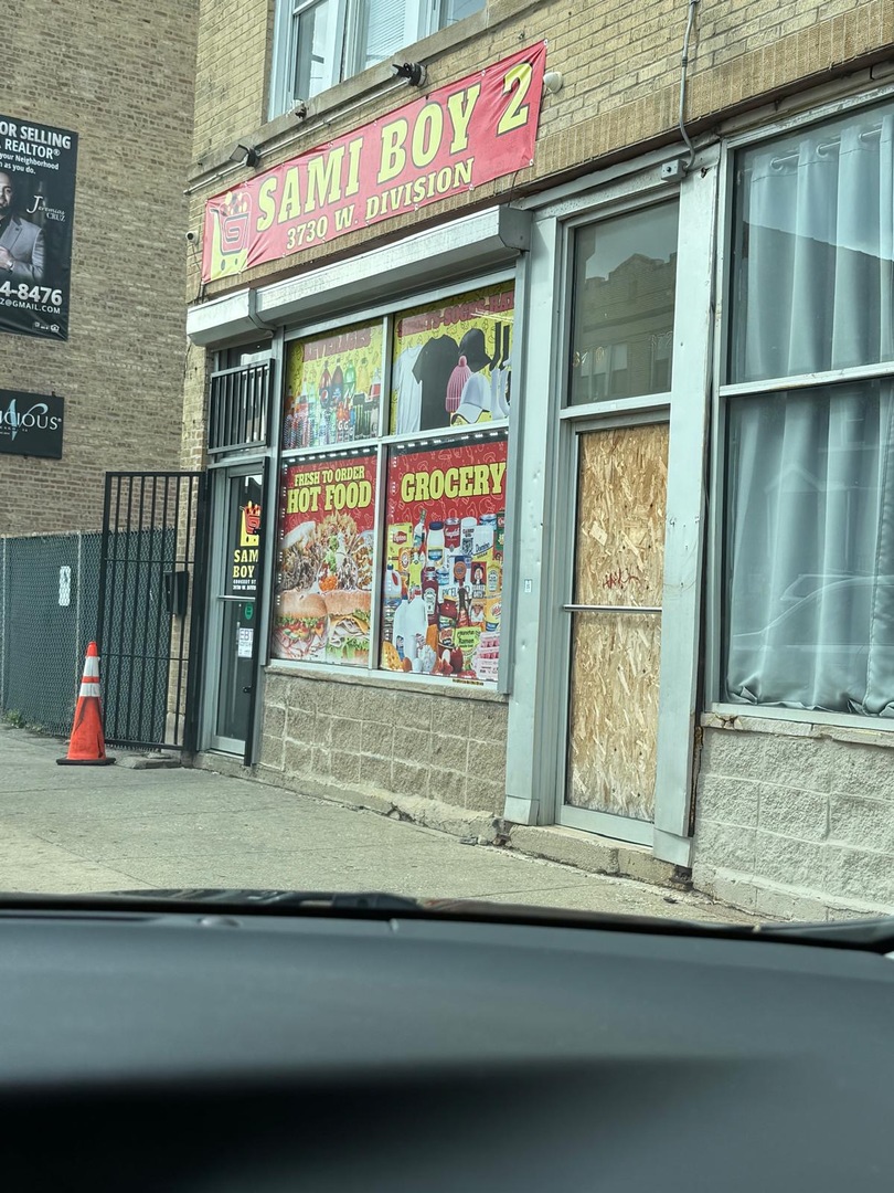 a view of a brick house with a large windows