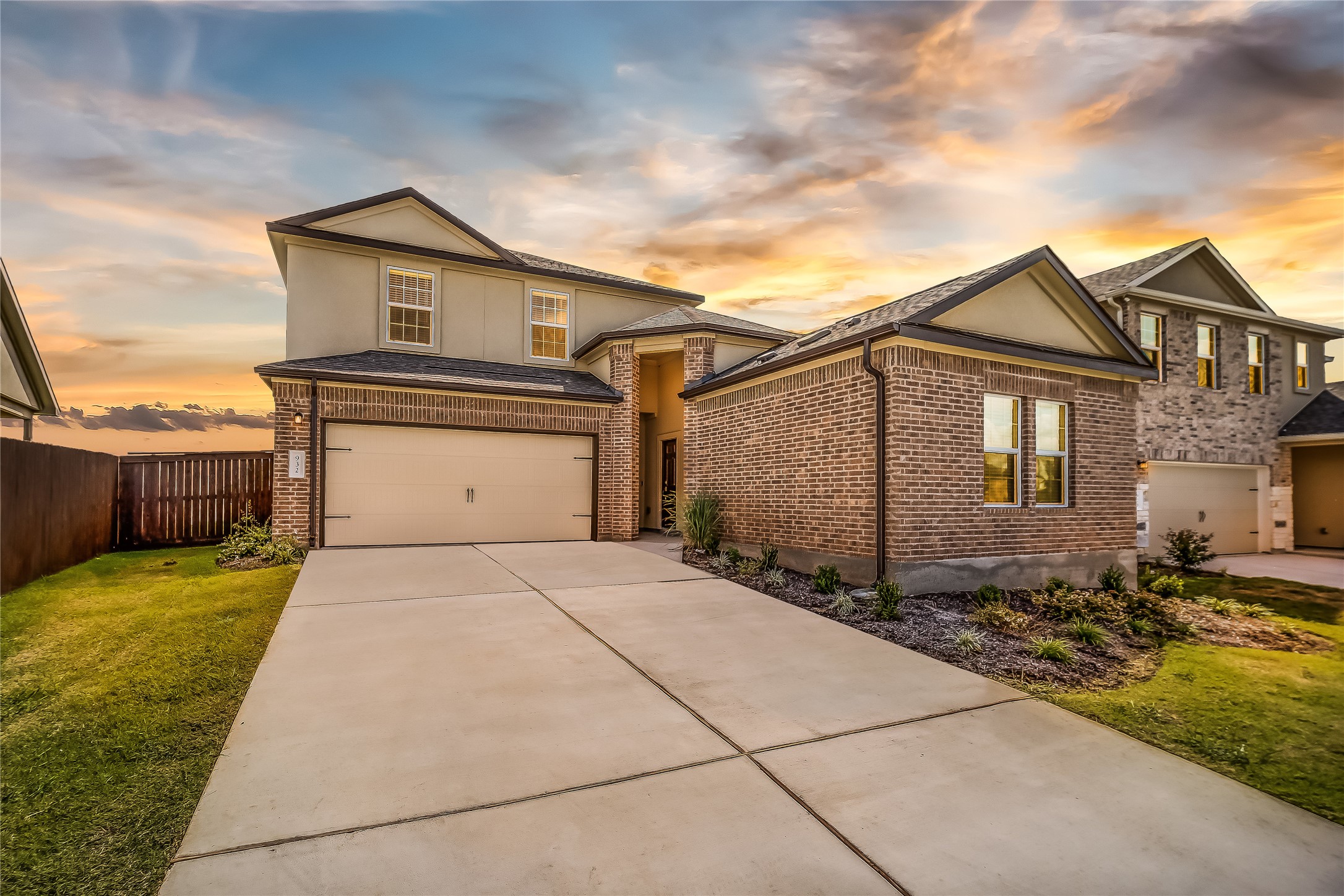 932 Mallow Road Leander, TX 78641 - Photo 1 of 40 a front view of a house with a garden