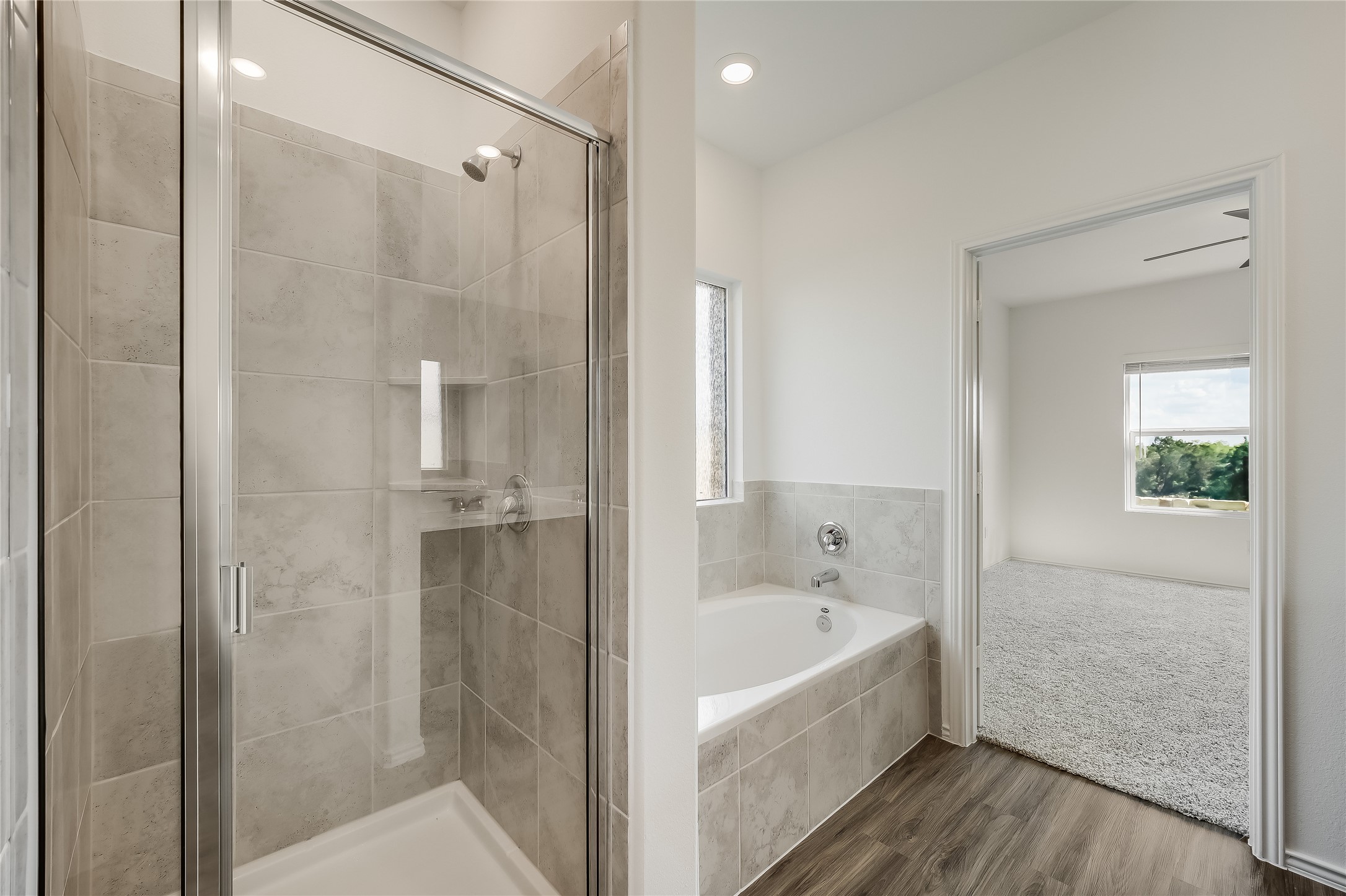 932 Mallow Road Leander, TX 78641 - Photo 12 of 40 a white bath tub sitting next to a bathroom sink