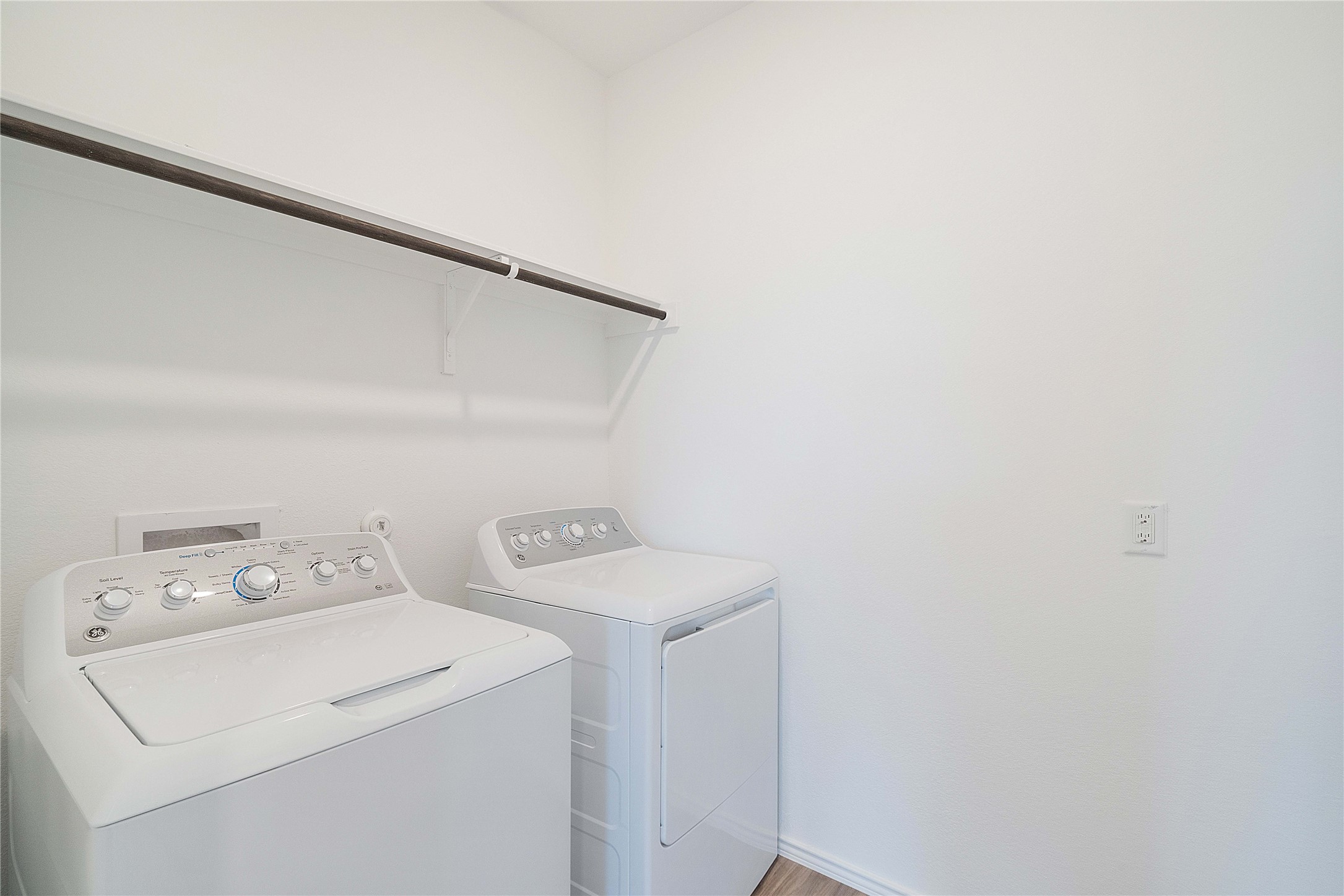 932 Mallow Road Leander, TX 78641 - Photo 13 of 40 Dedicated laundry space featuring a white top-load washing machine and front-load dryer