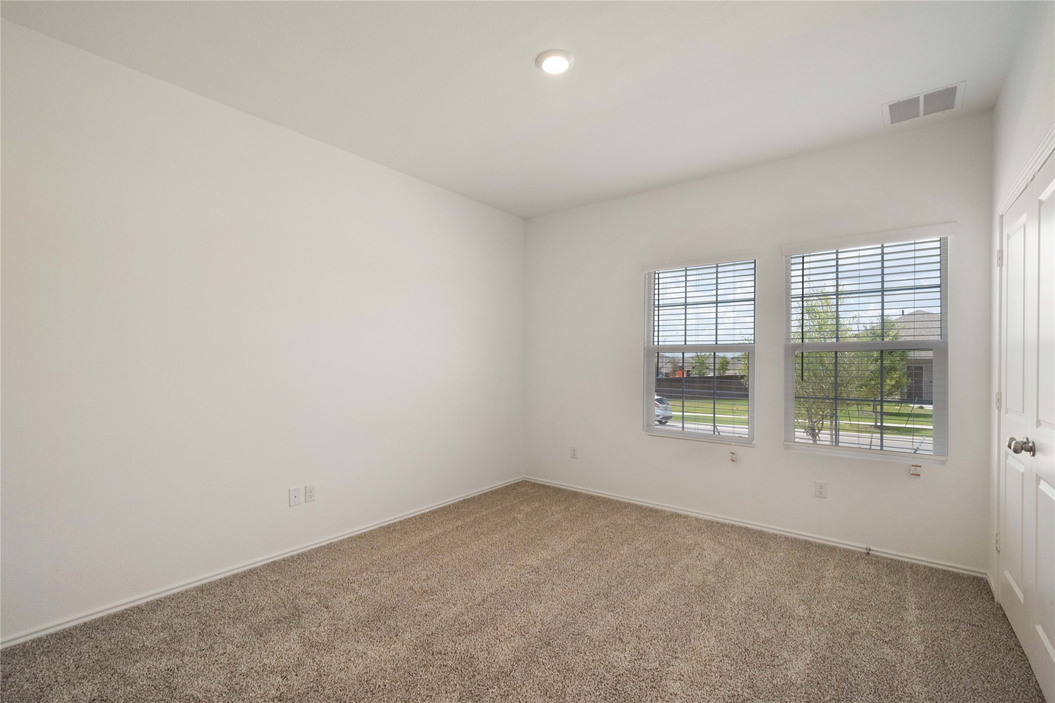 932 Mallow Road Leander, TX 78641 - Photo 20 of 40 Room with neutral carpeting and white walls