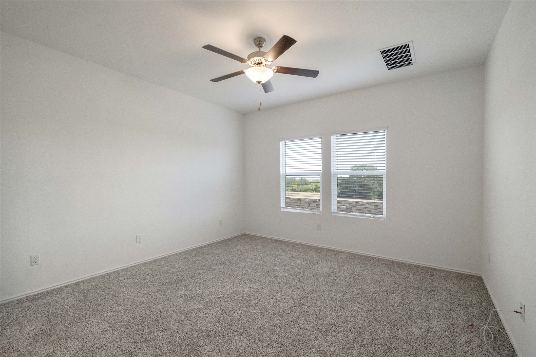 932 Mallow Road Leander, TX 78641 - Photo 9 of 40 an empty room with ceiling fan and window