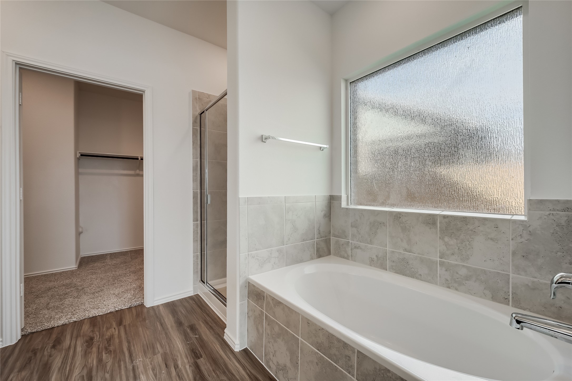 932 Mallow Road Leander, TX 78641 - Photo 10 of 40 a bathroom with a tub and shower