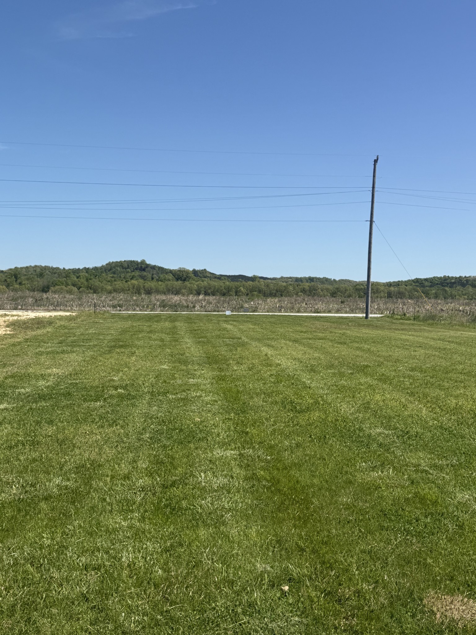 941 Hardin Bottom River Road Clifton, TN 38425 - Photo 12 of 19 a view of an ocean with a mountain in the background
