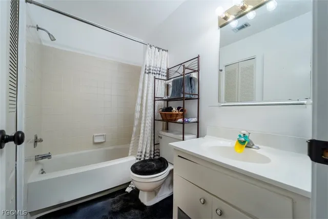 a bathroom with a sink a toilet and a bathtub