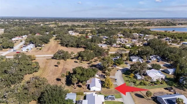 an aerial view of residential building and lake