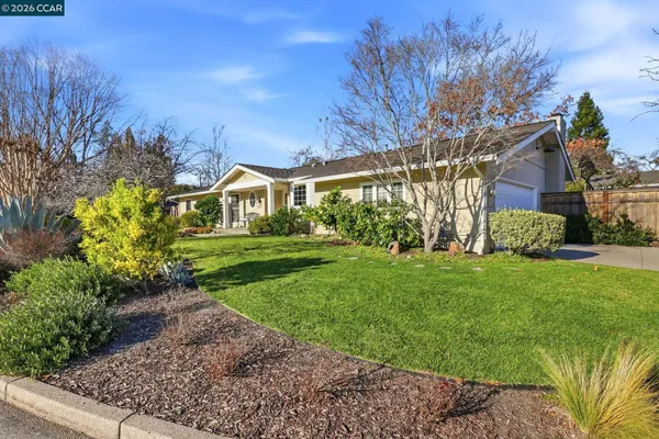 a view of house with yard