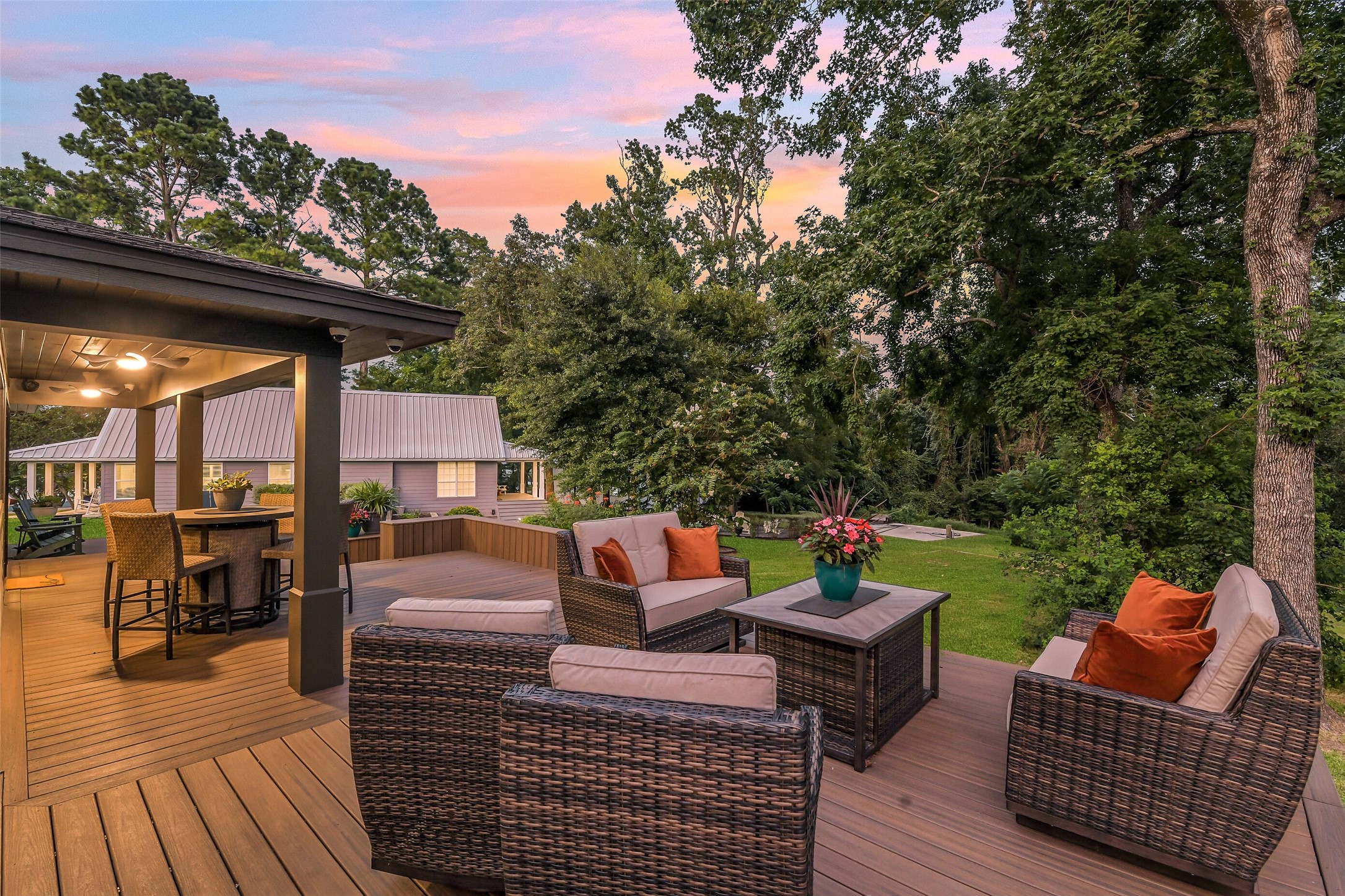 0 Camilla Lake Road Coldspring, TX 77331 - Photo 25 of 50 Brick House: Surrounded by established trees and lush landscaping, the multilevel deck creates an inviting setting for conversation, entertaining or peaceful mornings outdoors.