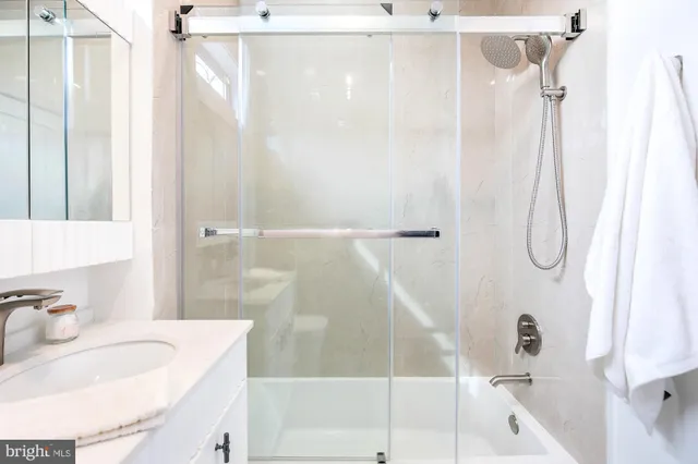 a bathroom with a sink and a shower