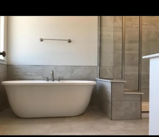 a picture of a bathtub in a bathroom