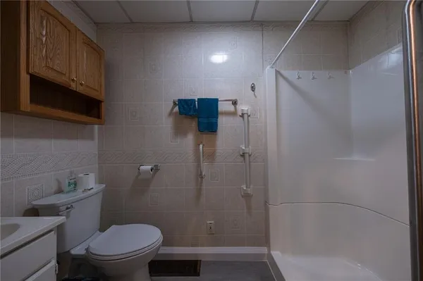 a view of an entryway with wooden floor and door