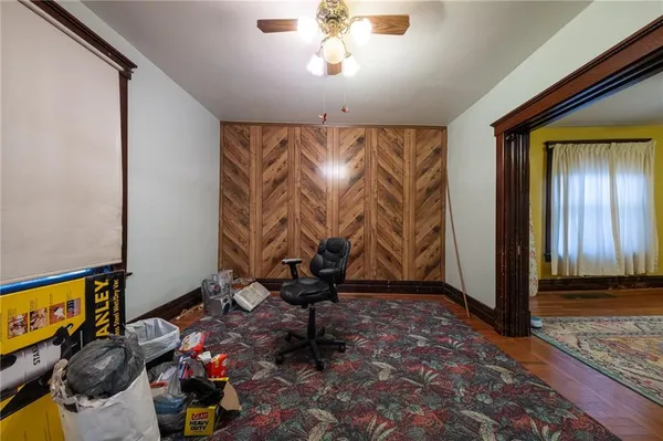 a living room with a couch and a chandelier