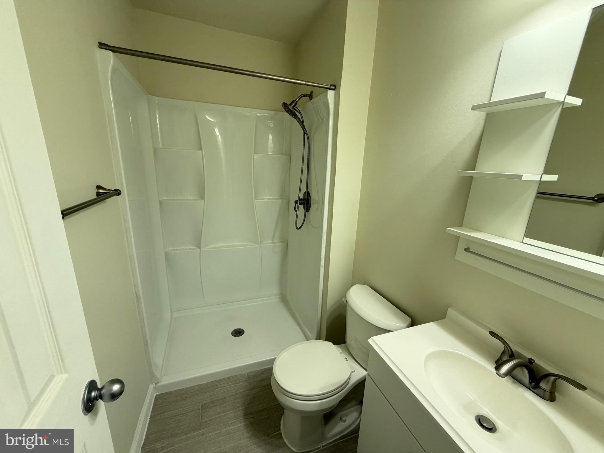 6427 Old Scotts Court Springfield, VA 22152 - Photo 16 of 27 a bathroom with a sink toilet and shower