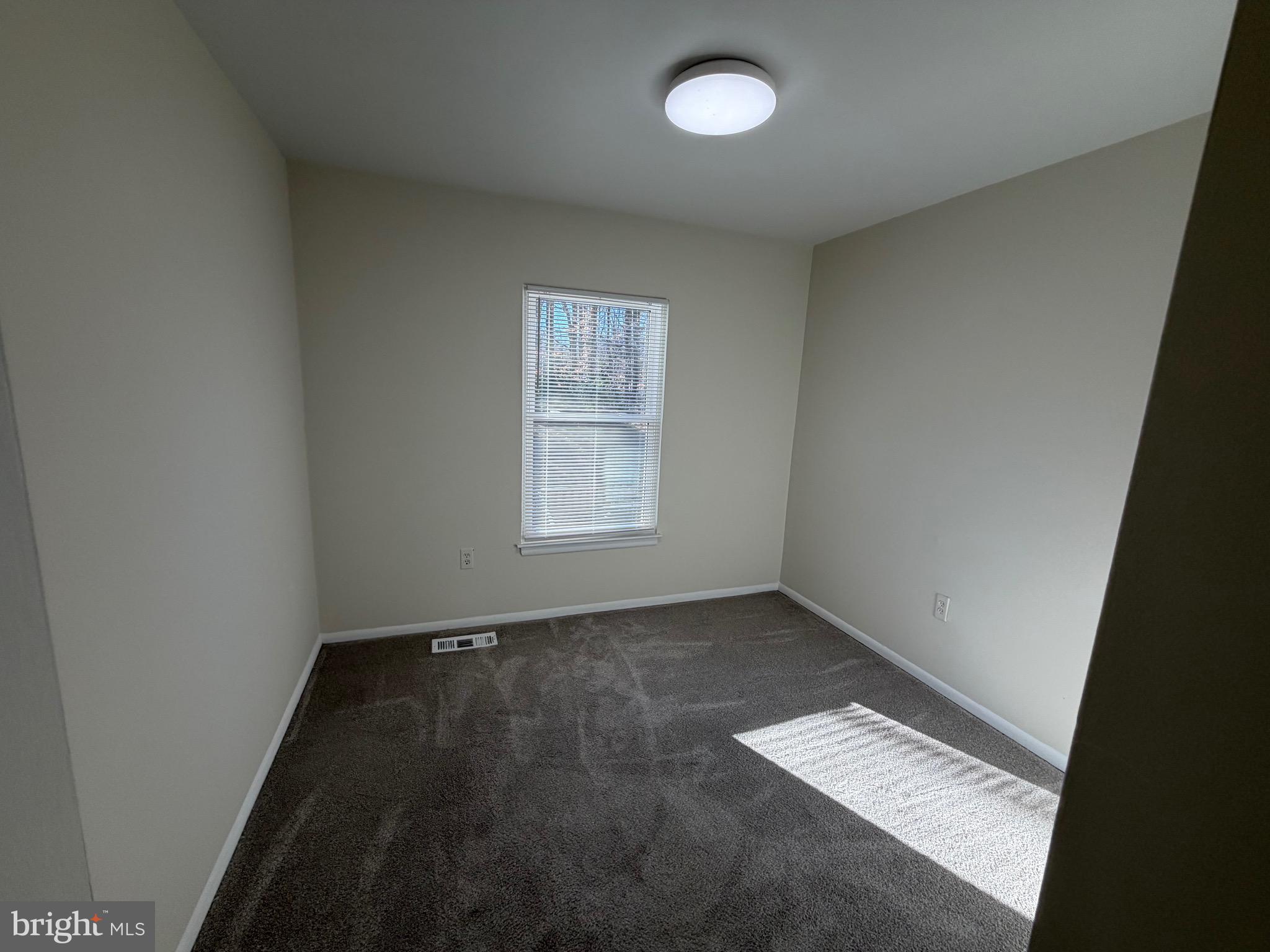 6427 Old Scotts Court Springfield, VA 22152 - Photo 17 of 27 an empty room with windows