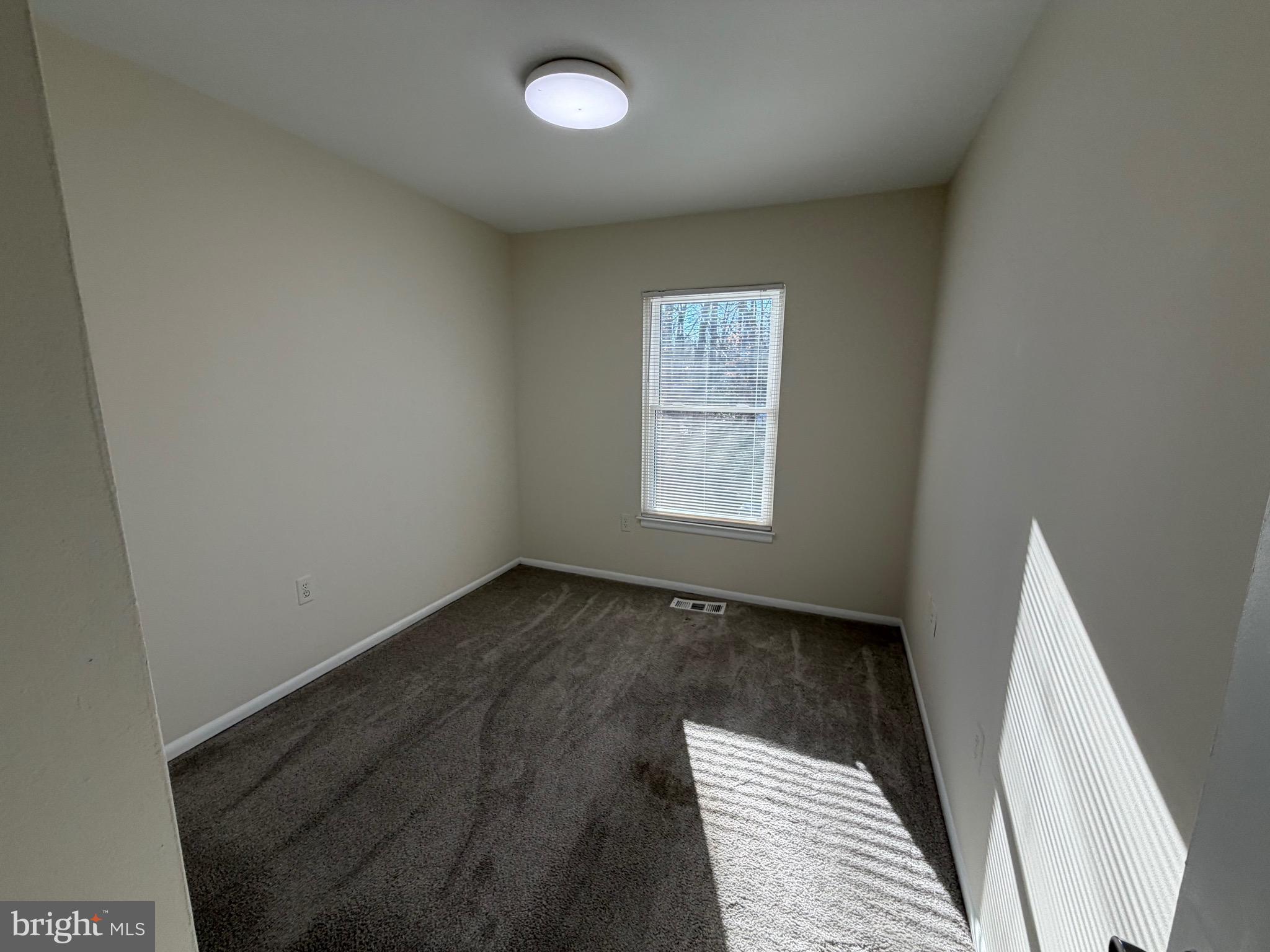 6427 Old Scotts Court Springfield, VA 22152 - Photo 19 of 27 an empty room with a window