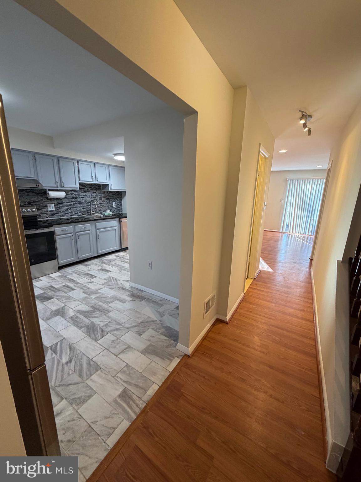 6427 Old Scotts Court Springfield, VA 22152 - Photo 10 of 27 a view of a kitchen from the hallway
