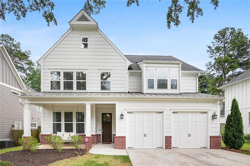 a view of a house with a yard and sitting space
