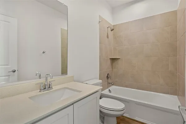 a bathroom with a sink a toilet and a bathtub