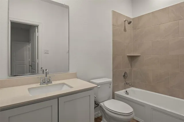 a bathroom with a sink toilet a vanity and shower