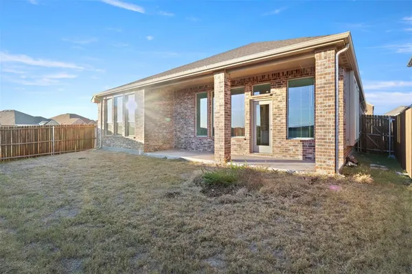 a view of backyard with cabin