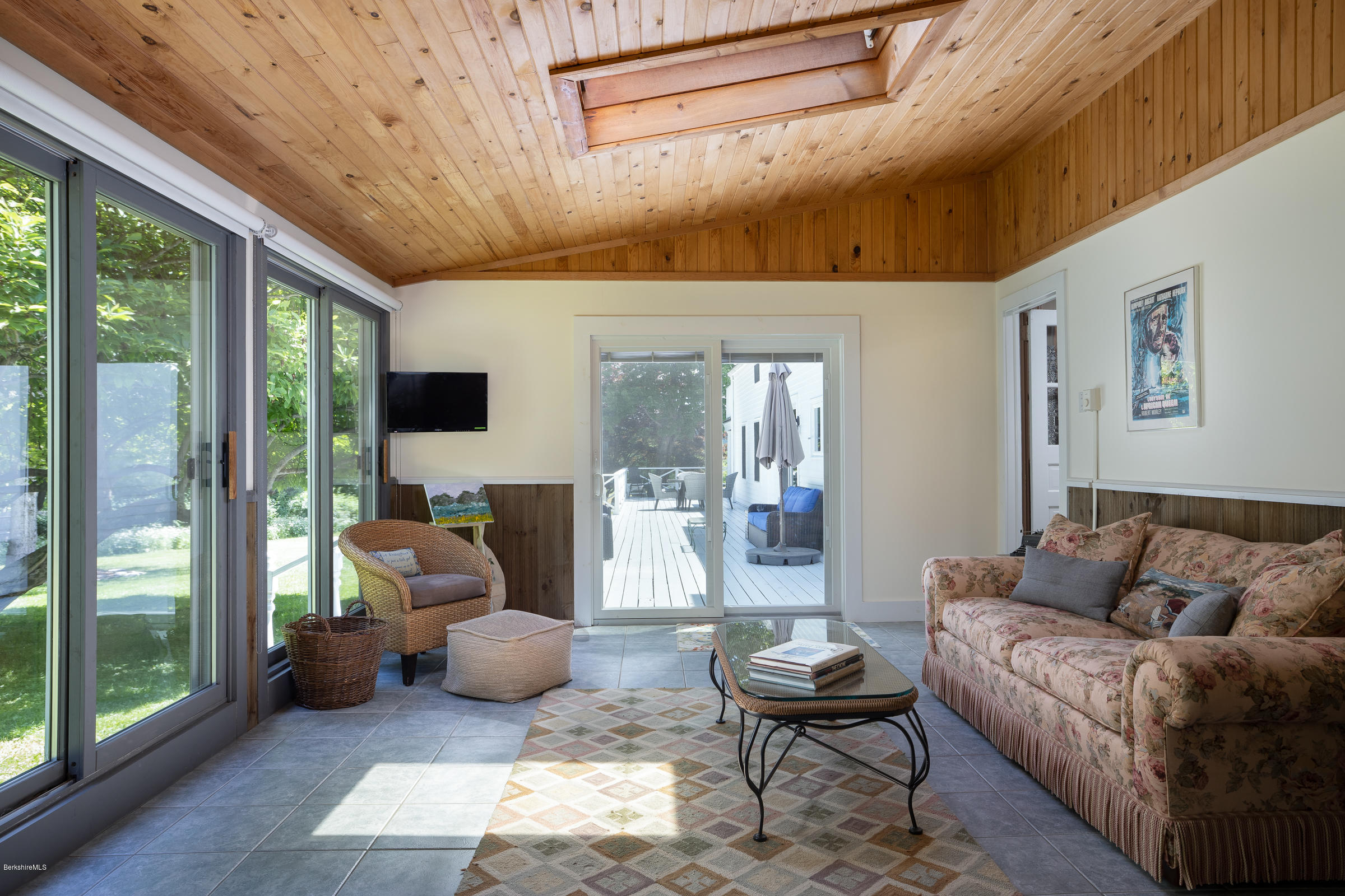 78 Interlaken Road Stockbridge, MA 01262 - Photo 14 of 36 a living room with furniture and a floor to ceiling window