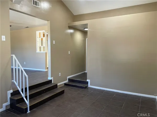 a view of a hallway with staircase