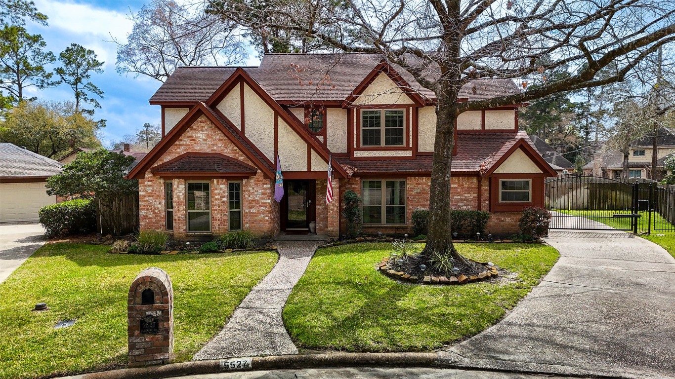 5527 Glenmere Lane Spring, TX 77379 - Photo 1 of 40 a front view of a house with a yard table and chairs