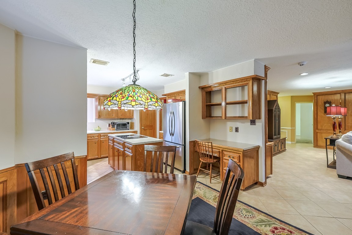 5527 Glenmere Lane Spring, TX 77379 - Photo 12 of 40 a view of a dining room with furniture window and wooden floor